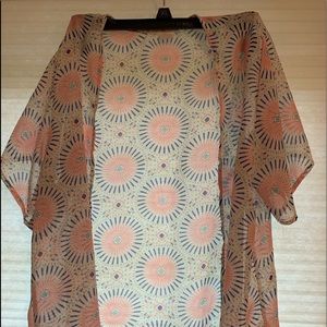 Cutest shell. Slip over a tank top and your outfit is complete.